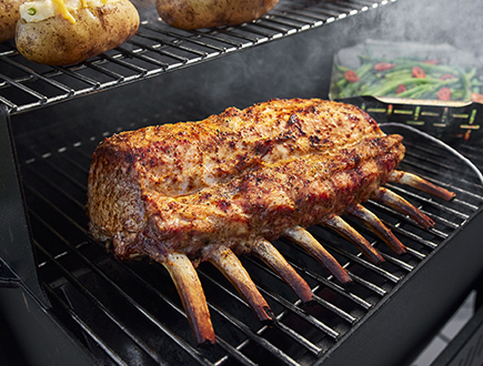 Rack of lamb smoking on the grill