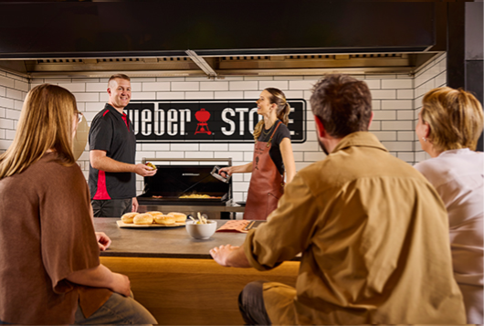 Portable Weber barbecues displayed in store