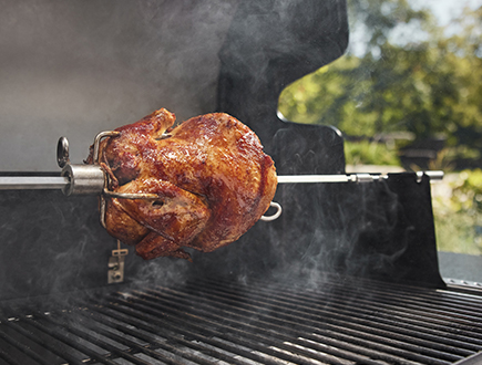 Whole chicken turning on the rotisserie
