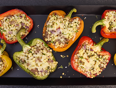Stuffed capsicums roasted on a tray