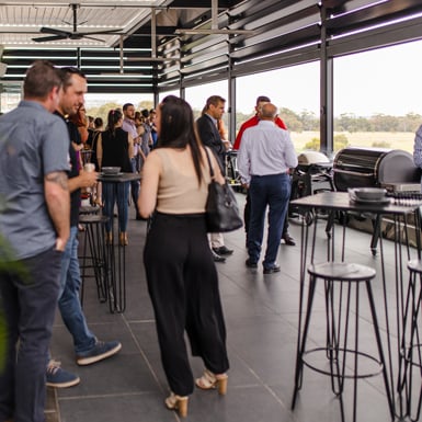 Guest enjoying food and a drink at Grill Academy