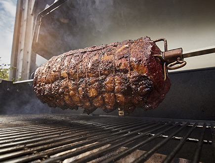 Rolled lamb roast turning on the rotisserie