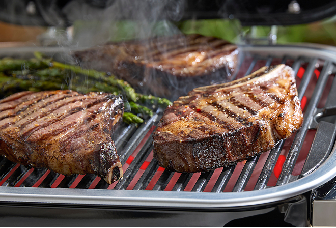 Delicious steak grilling on a Weber Verve Smart Electric Barbecue, with temperature monitored using a Weber smart probe.
