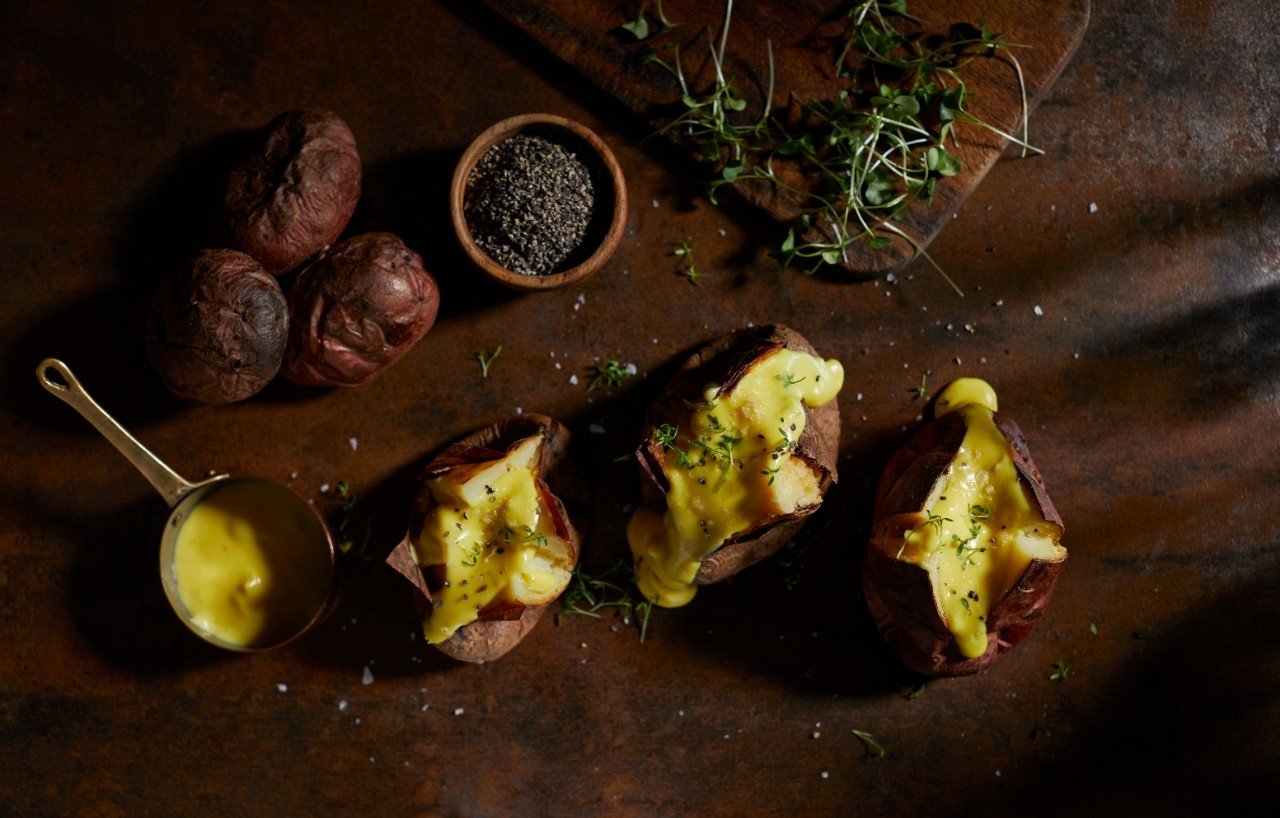  Coal baked potatoes with smoked cheese and mustard sauce
 

