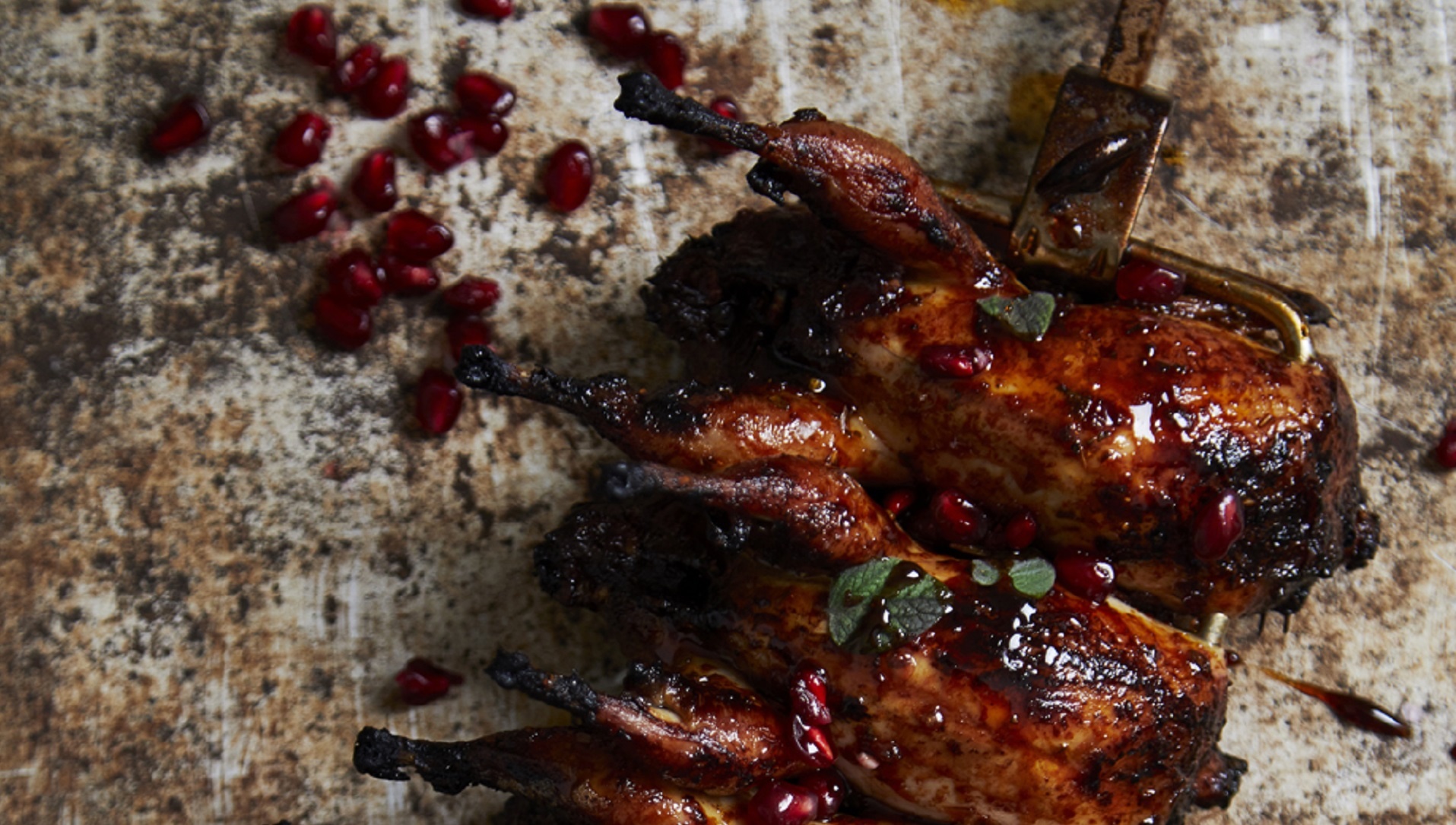  Sticky rotisserie quail with burnt chilli harissa sauce


